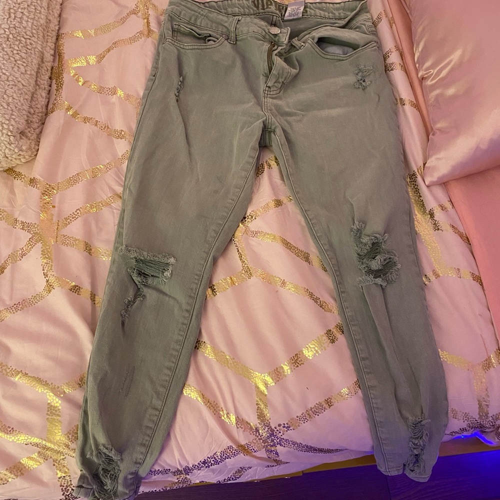 green ripped jeans